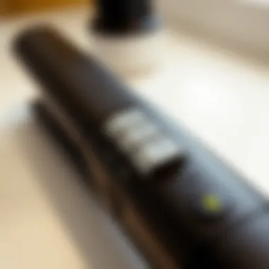 Close-up of adjustable temperature controls on a flat iron