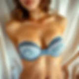 Elegant bandeau tube bra displayed on a soft fabric background.