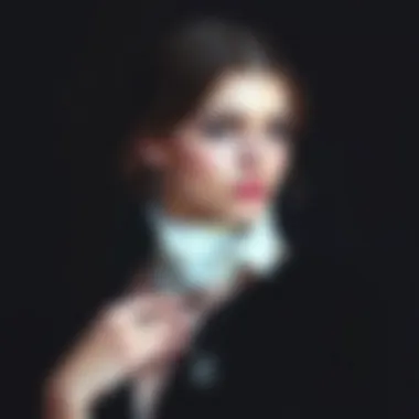 A model elegantly displaying a gothic font necklace against a dark, moody background