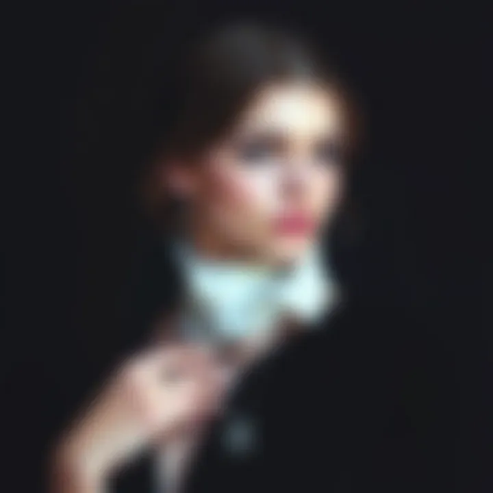 A model elegantly displaying a gothic font necklace against a dark, moody background