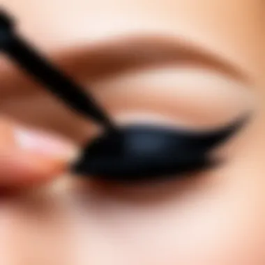 A detailed demonstration of liquid eyeliner application on a model's eye.