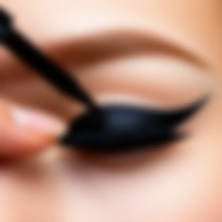 A detailed demonstration of liquid eyeliner application on a model's eye.