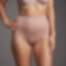 Elegant tummy control panties displayed on a soft fabric background