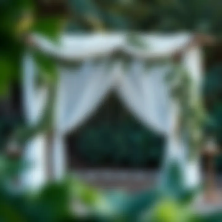 Rustic wedding arch decorated with drapes and greenery