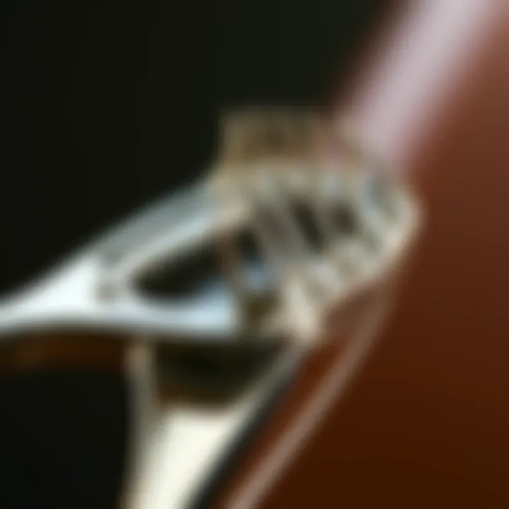 Detailed view of an eyelash separator tool showing its unique design