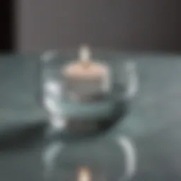 Elegant floating glass tea light candle holder in a serene setting
