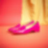 Stylish fuchsia flats on a vibrant background