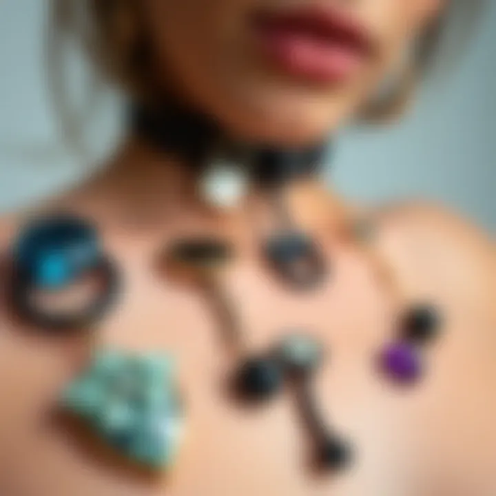 A collection of various goth belly rings highlighting diverse materials and styles