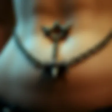Close-up of a unique belly ring featuring spikes and chains, reflecting goth aesthetics