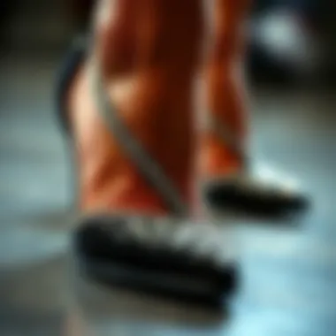 A close-up of the shimmering rhinestones on black wedge heels