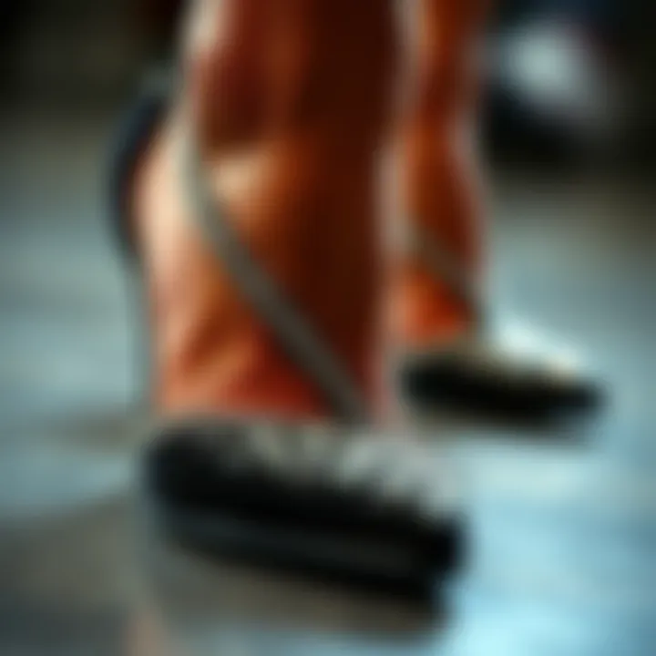 A close-up of the shimmering rhinestones on black wedge heels