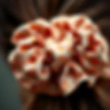 A close-up of a scrunchie adorned with intricate patterns