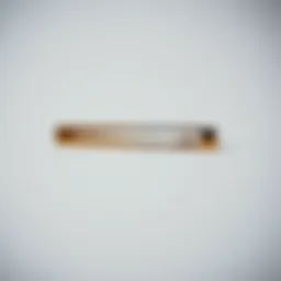 Elegant invisible tie clip shown against a minimalist background