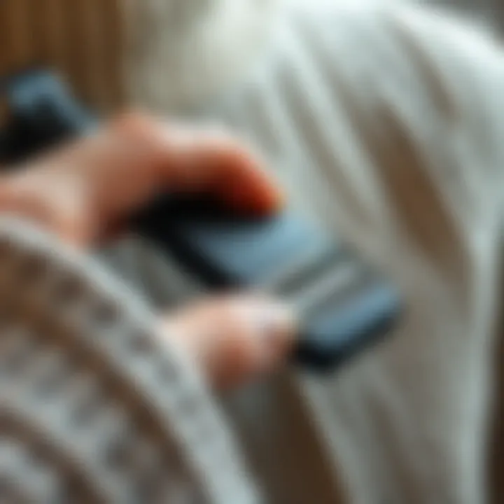 Close-up of a manual fabric shaver in action on a wool sweater