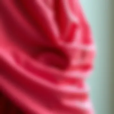 Intricate Fabric Details of the Cape Dress Close-up of fabric details in the one sleeve cape dress