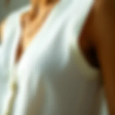 Quality Fabric of a White Sleeveless Cardigan A close-up of the fabric texture of a white sleeveless cardigan showcasing quality