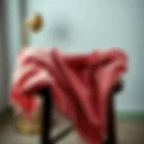 A thick shawl draped elegantly over a chair, showcasing its rich texture and color.