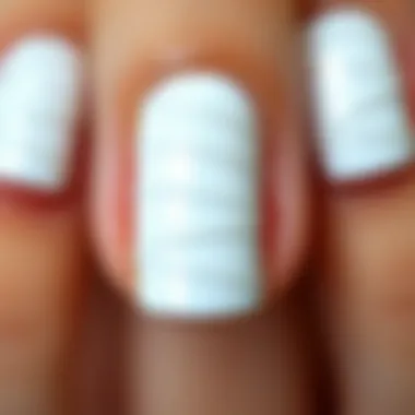 Achieving Perfection: Flawless Application of Nail Stickers Close-up of white nail stickers applied flawlessly