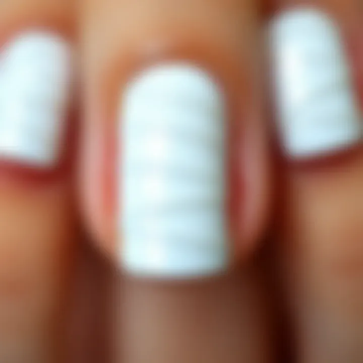 Achieving Perfection: Flawless Application of Nail Stickers Close-up of white nail stickers applied flawlessly