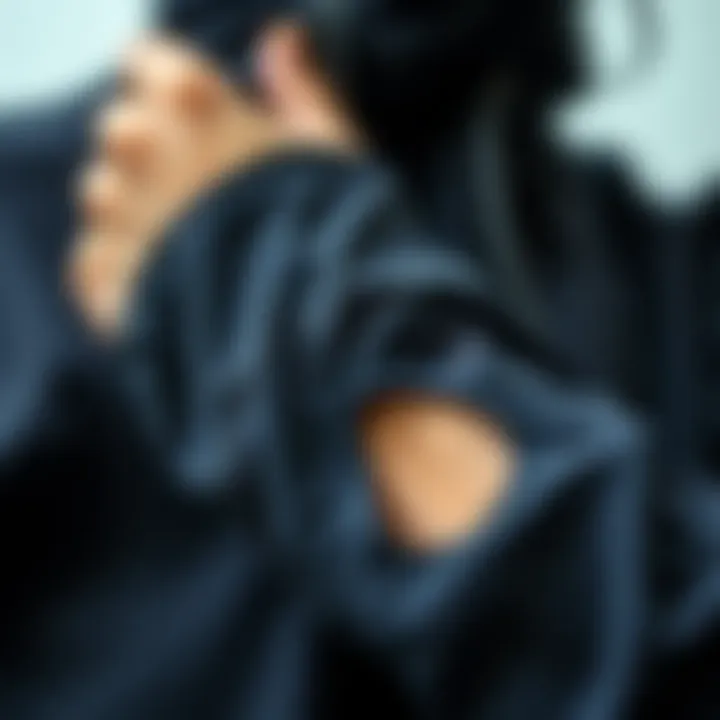 Close-up of thumb holes on a yoga jacket highlighting functionality